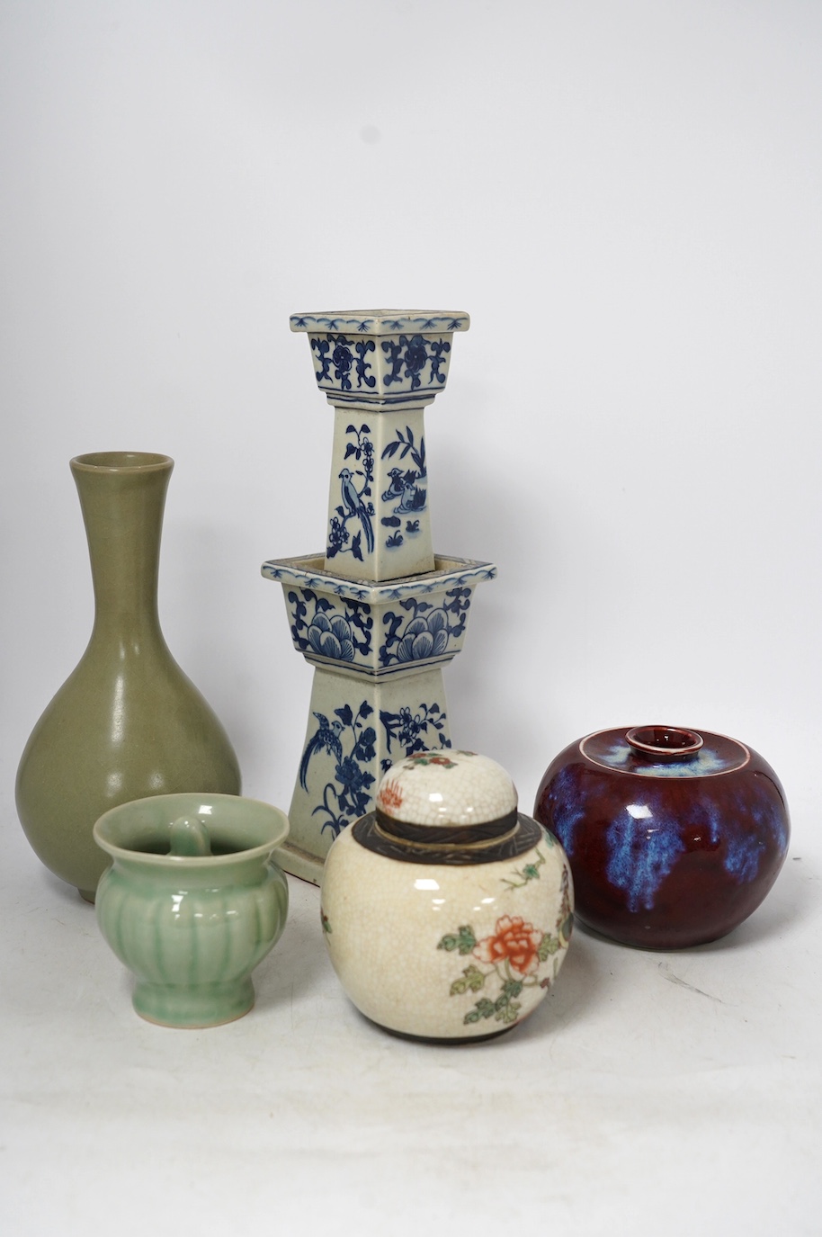 Chinese ceramics - a Celadon glazed vase, two jars and covers, a blue and white candlestick and a celadon pot, tallest 29cm (5). Condition - fair to good